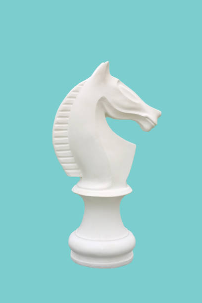 istock White horse chess isolated on cyan background - clipping path 1308618176