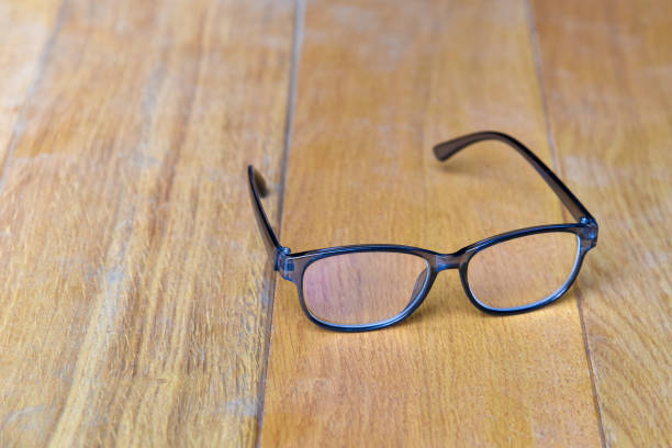 istock Glasses transparent grey Frame vintage style on wood background 1308619373