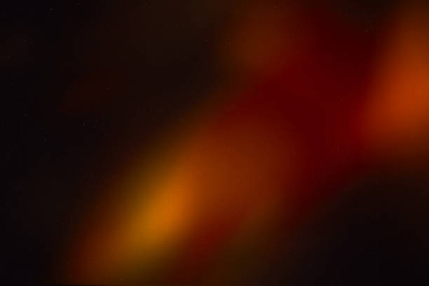 istock colorful warm rainbow light leaks on black background with dust texture 1308619731