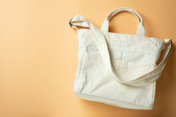 istock Stylish blank eco bag on beige background 1308619853