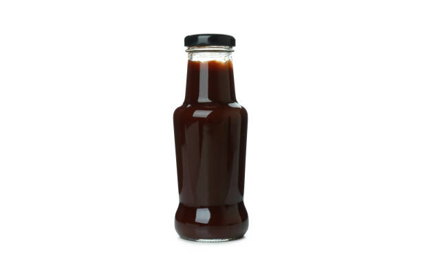 istock Bottle of barbecue sauce isolated on white background 1308620780