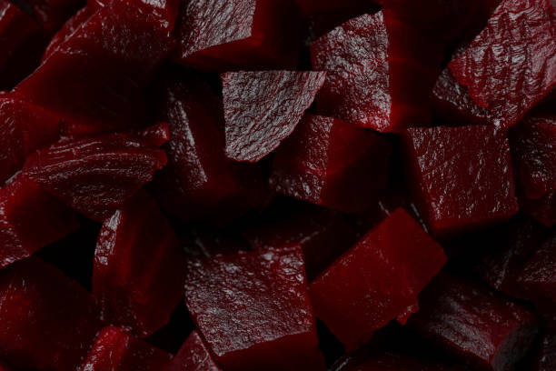istock Fresh beet cubes on whole background, close up 1308622435