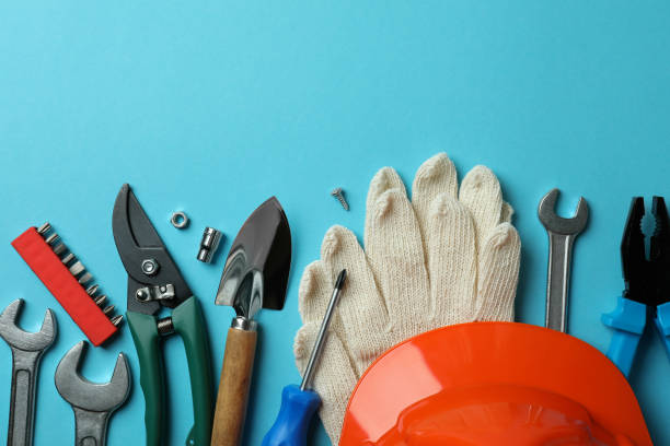 istock Concept of Labor Day with different tools on blue background 1308625234