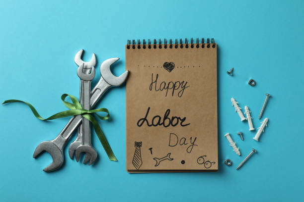 istock Concept of Happy Labor Day with different tools on blue background 1308626055