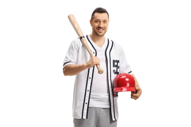 istock Young man with a baseball bat and a helmet in his hand 1308629352