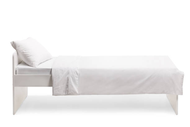 istock Studio shot of a white single bed 1308629791