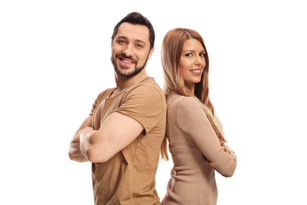 istock Couple posing back to back and smiling 1308629801