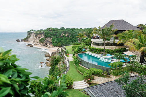 December 28, 2020. Bali, Indonesia. Villa with swimming pool on a cliff and ocean