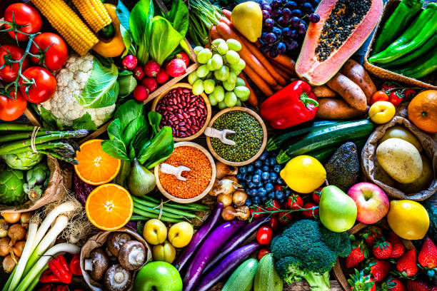 istock Fresh fruits, vegetables and legumes background 1308630335