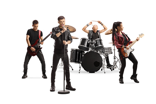 Rock music band performing with female guitarist, drummer and a male singer