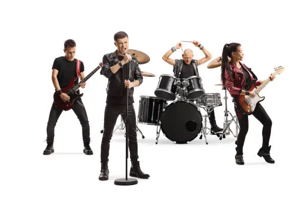 Photo of Rock music band performing with female guitarist, drummer and a male singer