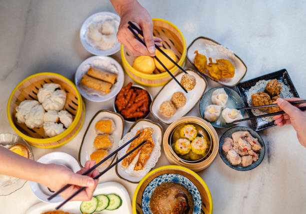 istock directly above human hand using chopstick picking up tradition chinese food dim sum 1308631674