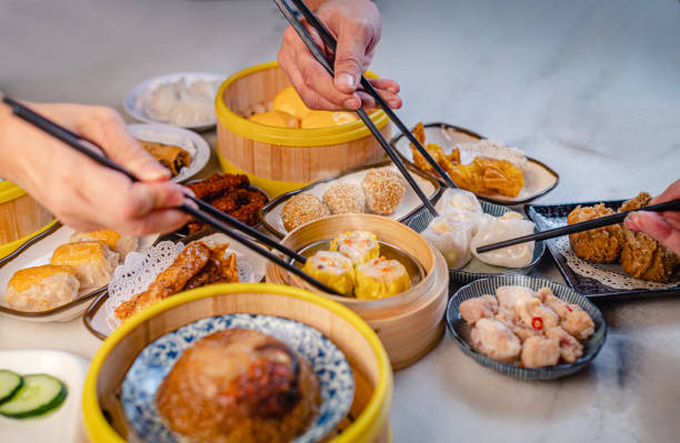 istock human hand using chopstick picking up tradition chinese food dim sum 1308631697