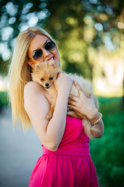 istock Young woman bonding with her puppy 1308631929