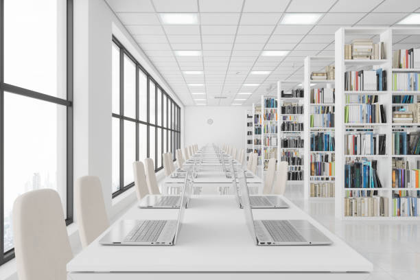 테이블에 노트북과 책장에 책과 현대 도서관. - library 뉴스 사진 이미지