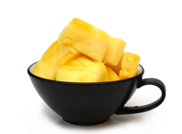 istock A full cubed slice pineapple bowl on white 1308634823