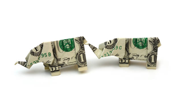 istock Two origami paper dollar elephants 1308635278