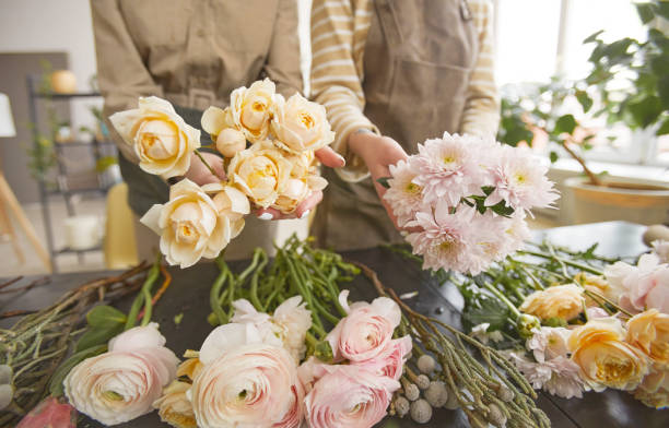 istock Florists Creating Compositions in Flower Shop 1308635429