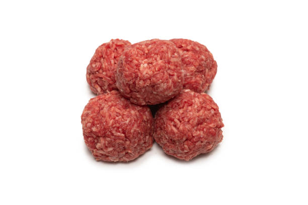 istock Raw meat balls isolated on white background. 1308637880