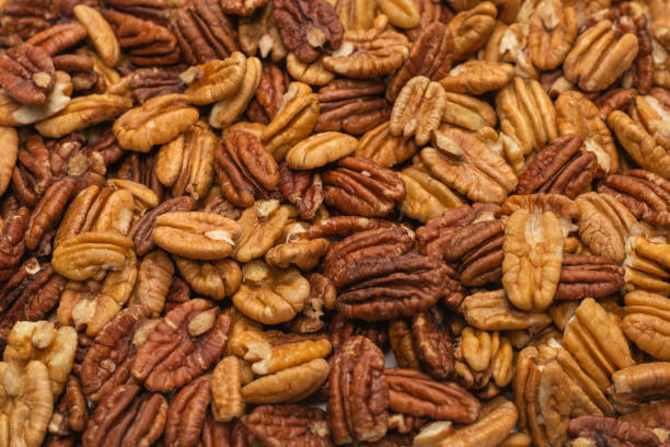 istock Tasty pecan-nut background. Top view. 1308637943