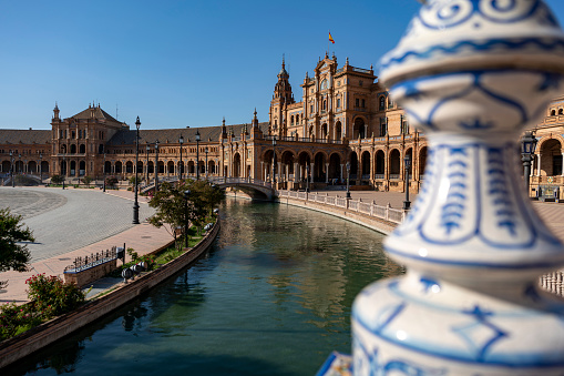 Water channel in the Plaza de España in Seville with ornamentation and bridge