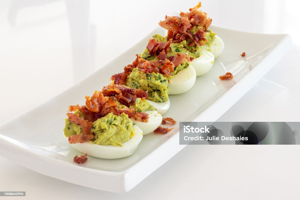 avocado deviled eggs with bacon lunch Deviled Egg Stock Photo