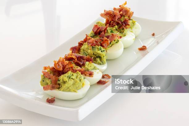 Avocado Deviled Eggs With Bacon Lunch Stock Photo - Download Image Now - Deviled Egg, Avocado, Bacon