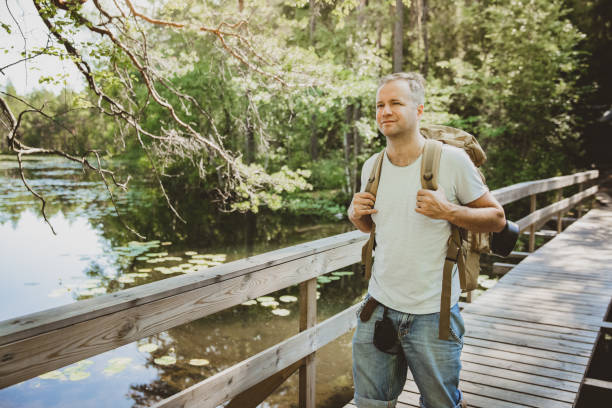 istock Mature man exploring Finnish nature in summer 1308643392