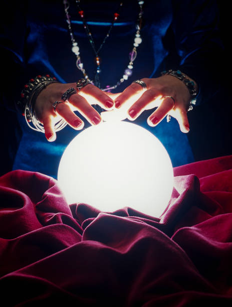 istock fortune teller hands on glowing crystal ball 1308643807