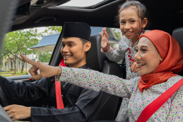 istock Family inside the car driving to celebrate eid 1308644120
