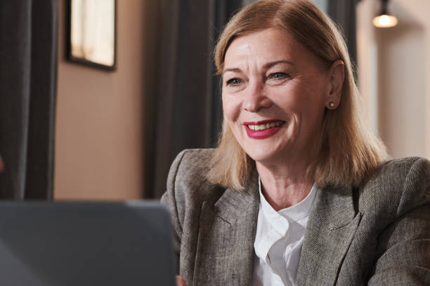 istock Mature businesswoman working on computer 1308646055