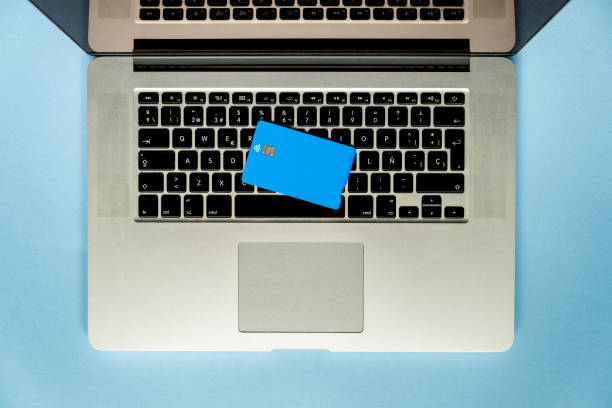 istock Blue credit card on a laptop keyboard 1308646862