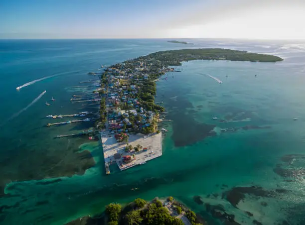 Caye Caulker island in Belize. Cloudy Morning Sky and Caribbean Sea in Background.