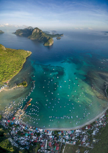 El Nido, Palawan, Philippines. Sunrise Light with Boats on Water. El Nido, Palawan, Philippines. Sunrise Light with Boats on Water. el nido photos stock pictures, royalty-free photos & images