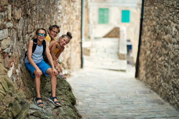 istock Kids sightseeing beautiful Italian town 1308652799