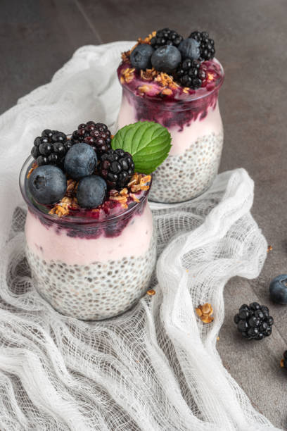 istock Chia pudding parfait with blackberries and blueberry smoothie and granola. 1308652960