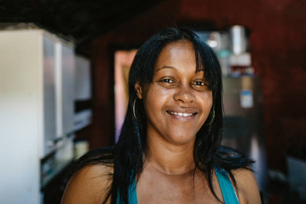 istock Smiling woman at home 1308654696
