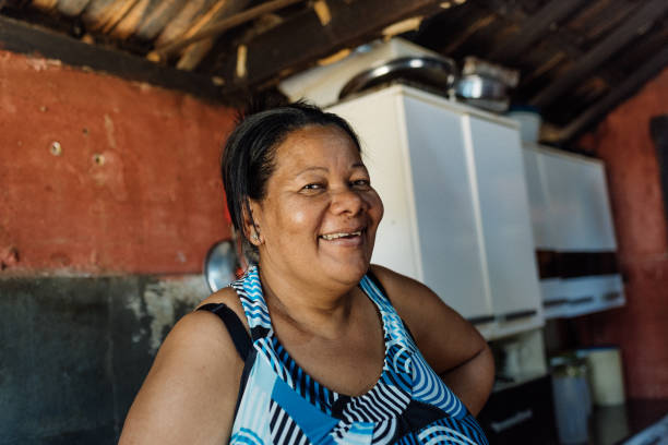 istock Smiling woman at home 1308654743