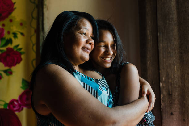 Love of mother and daughter Mother and daughter holding each other at home developing countries photos stock pictures, royalty-free photos & images