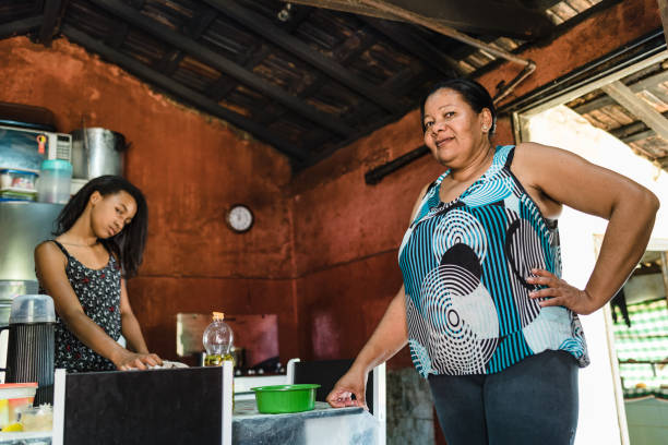 istock Mother and daughter in the kitchen 1308654970