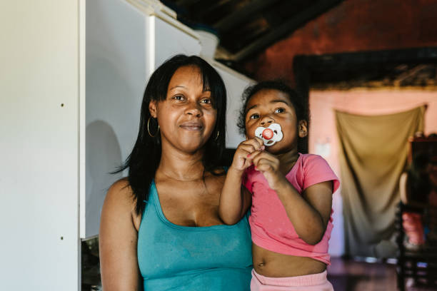 Portrait of a mother and daughter at home.
