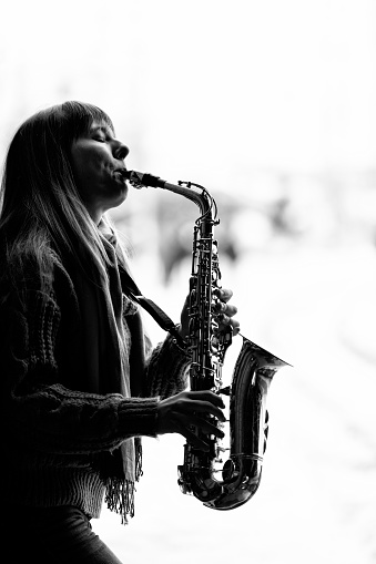 Saxophone Player Saxophonist playing jazz music. Sax alto Jazz Musician hands closeup