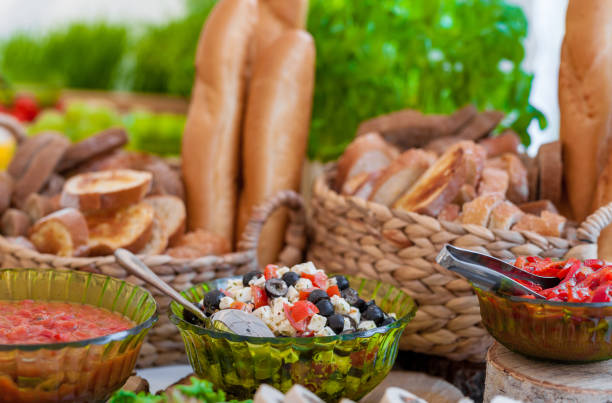 istock Wedding Table With Food. Snacks and Appetizer on the Table. Fish and Raw Meat with Vegetables. Traditional LIthuanian Bread in Background 1308658607