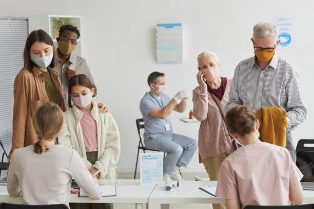istock People Registering for Vaccination in Clinic 1308661583