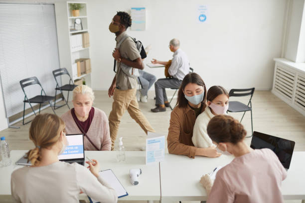 istock People at Vaccination Center Wide Angle 1308661599