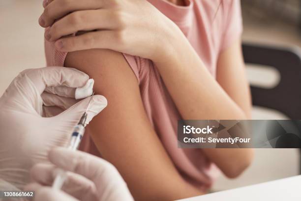 Doctor Vaccinating Little Girl Close Up Stock Photo - Download Image Now - Vaccination, Child, Coronavirus