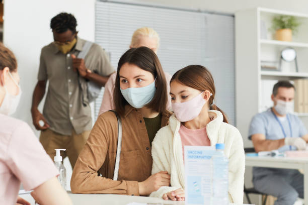 istock Family Registering at Vaccination Center 1308661690