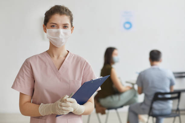istock Female Nurse in Waiting Room 1308661700