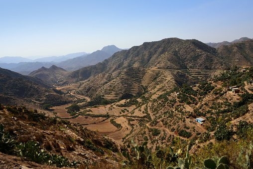 Arbaroba, Maekel / Central region, Eritrea: Eritrean Highlands wilderness - mountain horizon, looking down a valley and terraced agricultural fields,