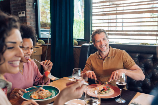 istock Group of business people having a lunch after work 1308670434